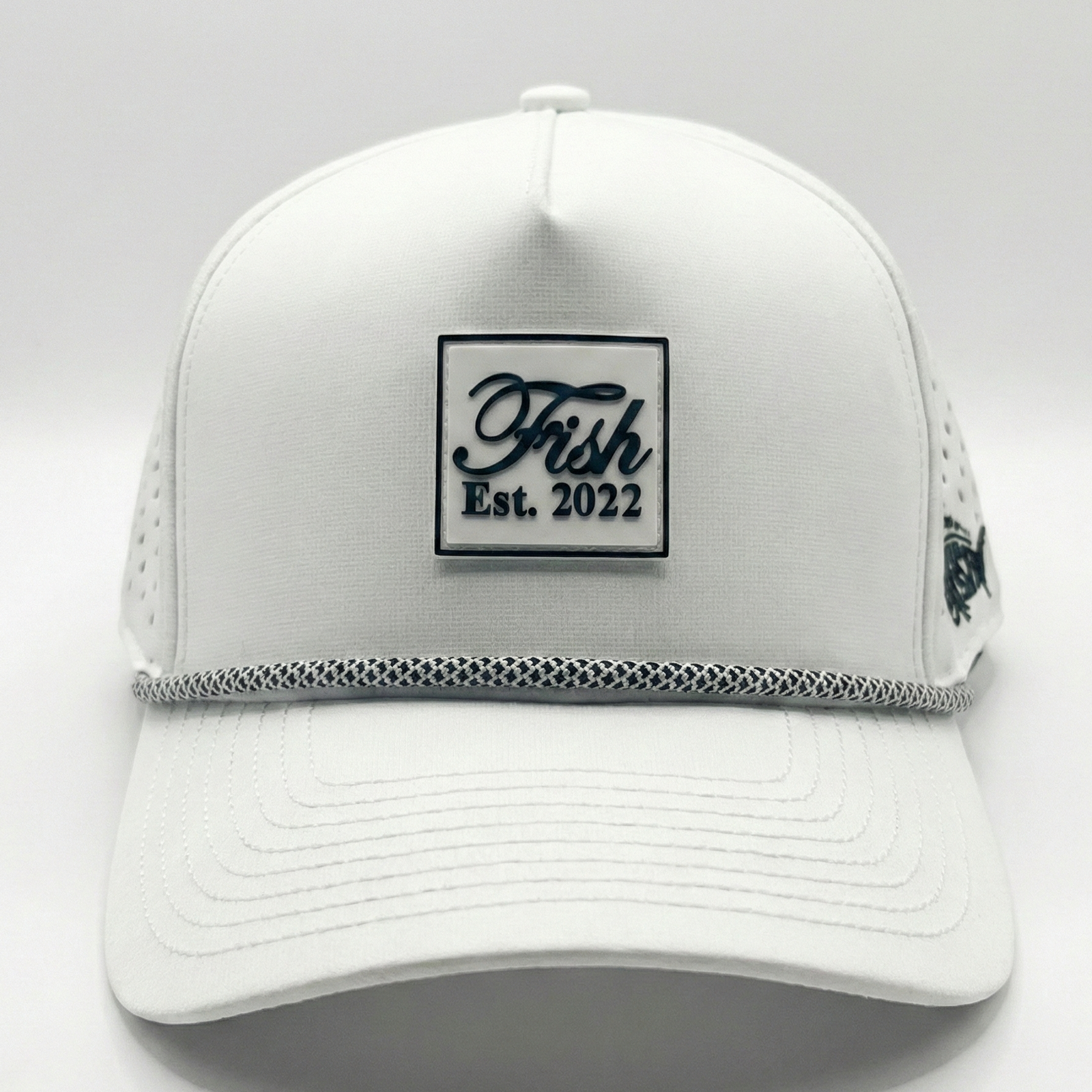 White golf hat with Fish rubber patch on white background