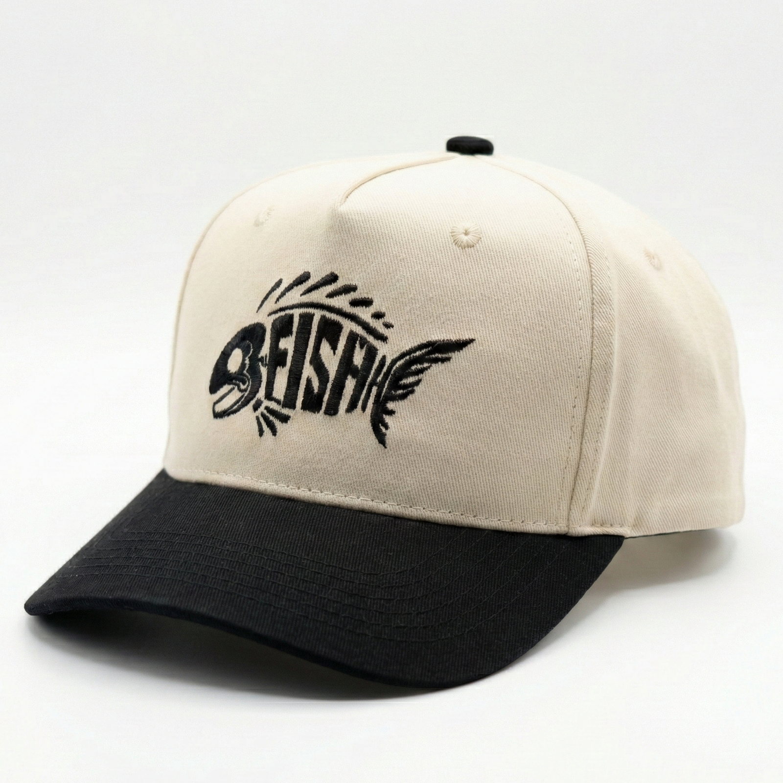 Beige and black cap with FISH logo on a white background
