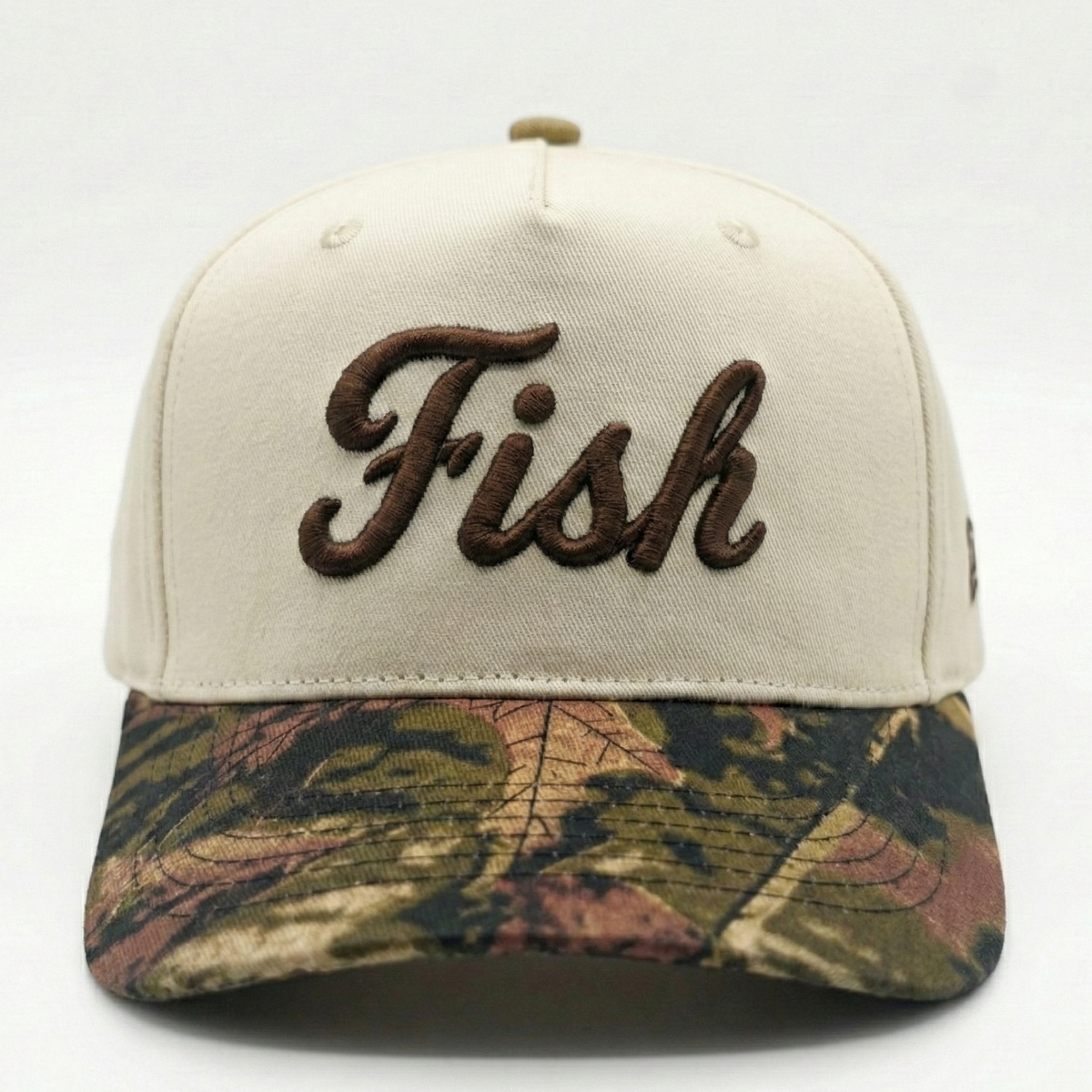 Beige and camo cap with FISH logo on a white background