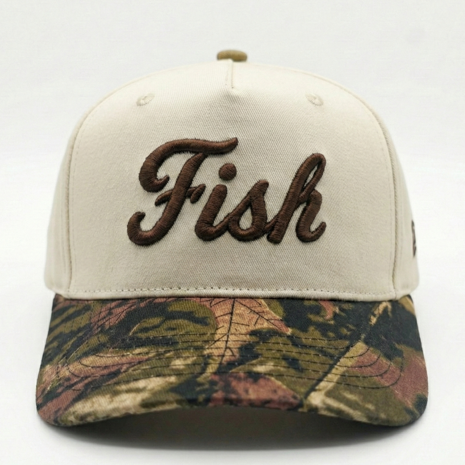 Beige and camo cap with FISH logo on a white background