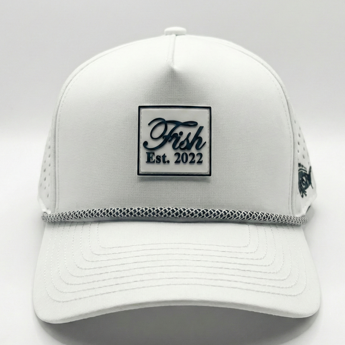 White golf hat with Fish rubber patch on white background